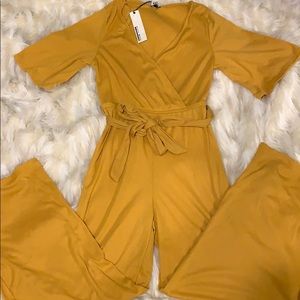Women Brand New size M mustard jumpsuit